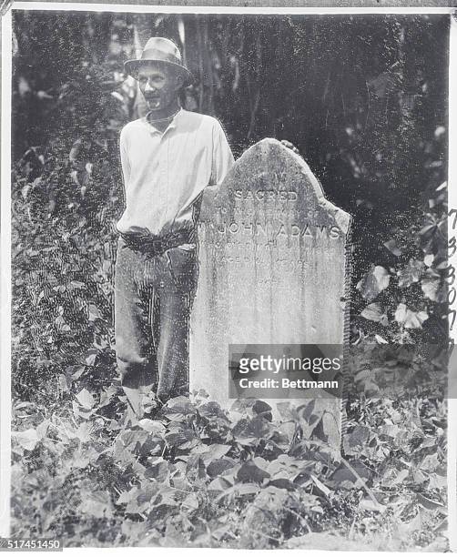 Norris Young, a Pitcairn Islander stands beside the grave of John Adams near Adamstown, the only village on the tiny island. Adams was the last...