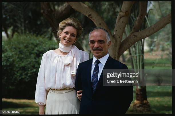 King Hussein of Jordan stands proudly with his wife, Queen Noor.