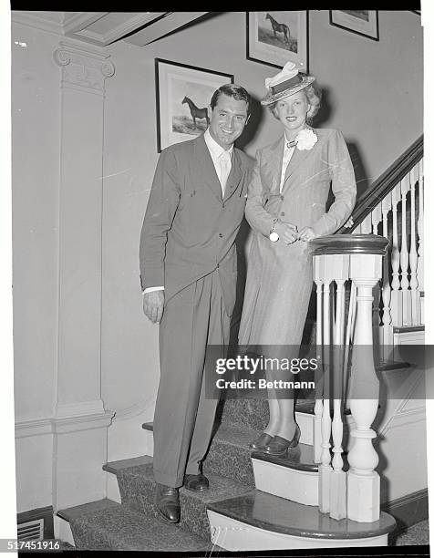 Handsome Cary Grant and lovely Phyllis Brooks affianced movie stars, pictured returning from abroad aboard the Ile de France, yesterday announced...