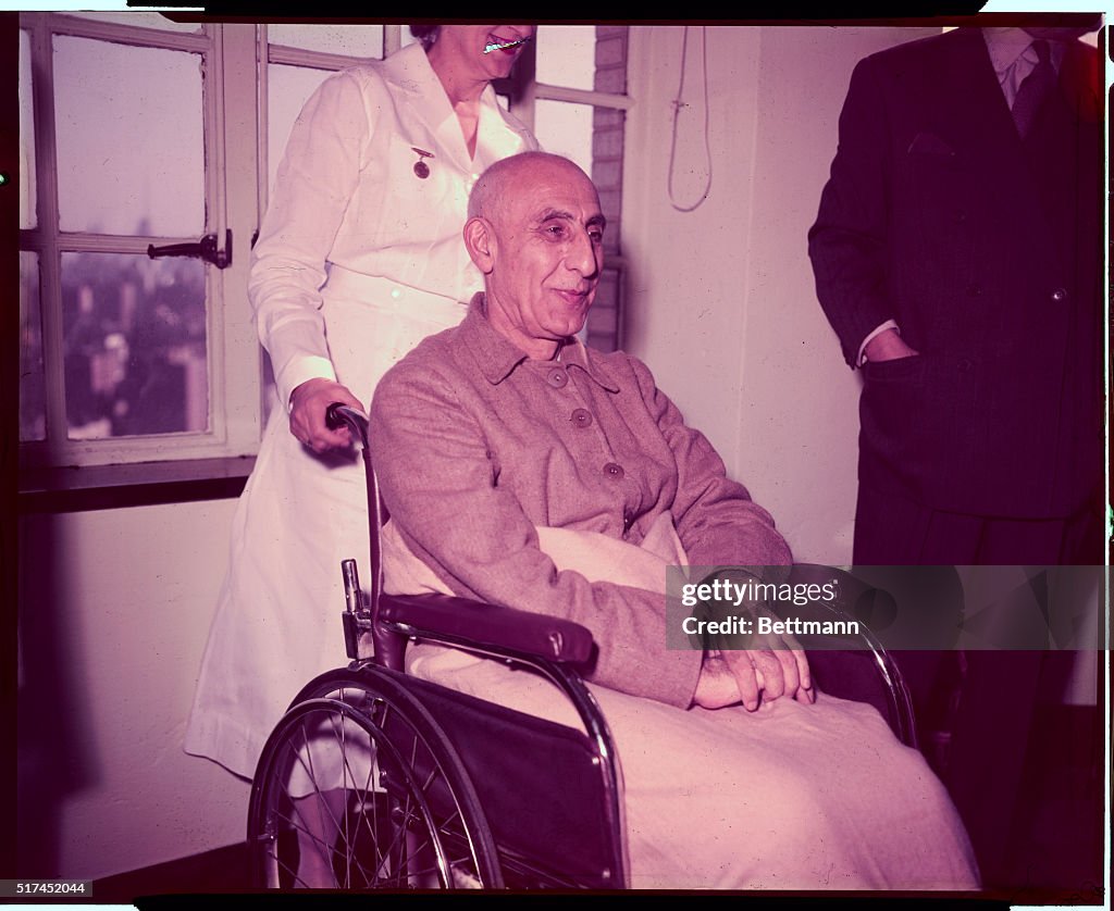 Mohammed Mossadegh Being Pushed in Wheelchair