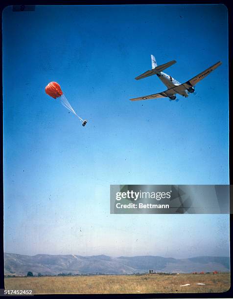 Cargo plane drops supplies to Marine reservists, during a field exercise at Camp Pendelton, California. The men have recently had two weeks of...