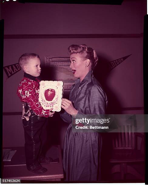Eve Arden gets "an apple for the teacher" from 3 year old Richard Graybill who thinks it's an appropriate sort of Valentine for teacher Connie...