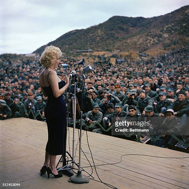 Marilyn Monroe is shown in this photo entertaining military troops in Korea.