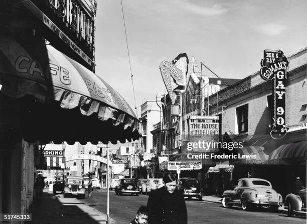 View along Pacific Street, featuring the Barbary Coast club, the unofficial flagship of the area that also featured numerous other clubs and bars,...