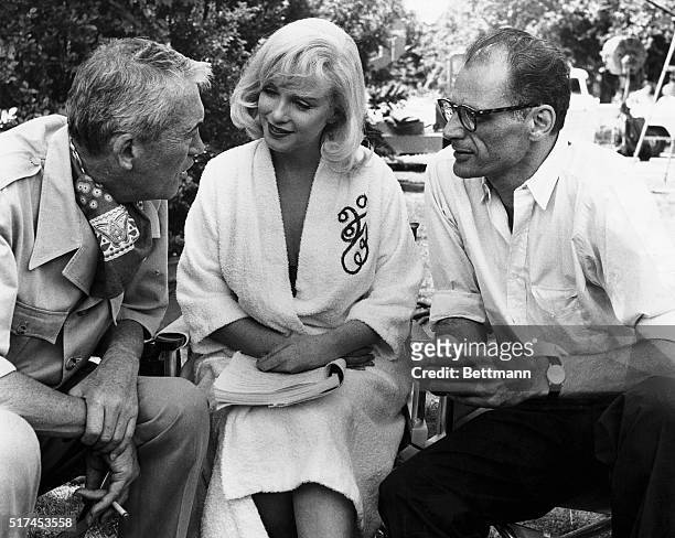 John Huston, Marilyn Monroe, and Arthur Miller on the set of 'The Misfits'
