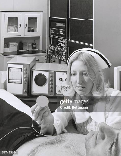 This new invention, that this nurse is working on this patient, is a minicomputer that can help detect heart detects.