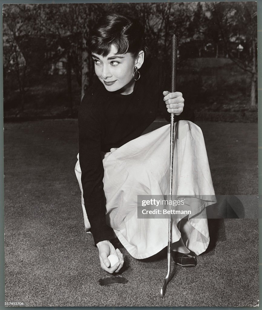 Audrey Hepburn Playing Golf