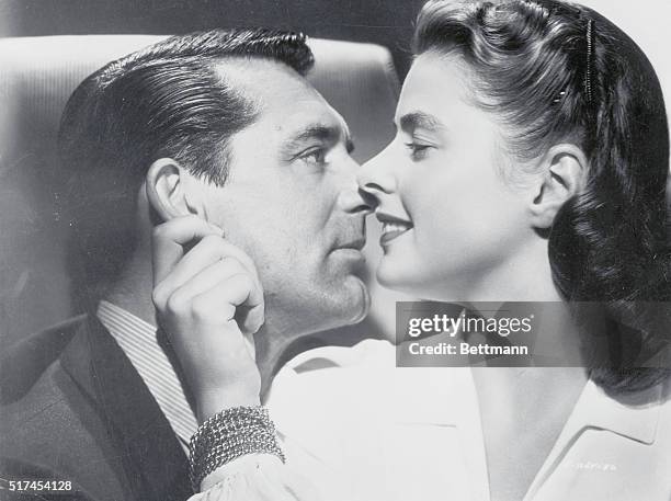 Close up of actor Cary Grant and actress Ingrid Bergman in a publicity photo for their film together in Alfred Hitchcock's Notorious. Ingrid Bergman...