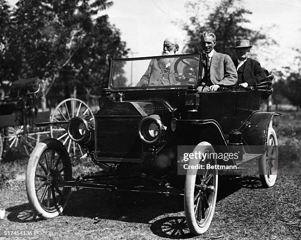 Henry Ford at wheel, John Burroughs and Thomas Edison in back seat of the Model T.