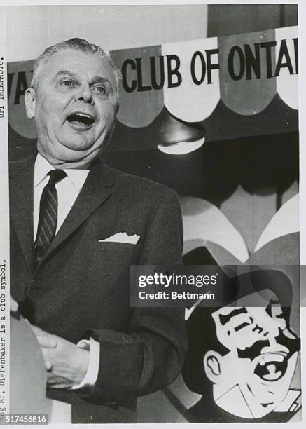 Toronto: Opposition leader John Diefenbaker entertains and amuses members of the Variety Club of Ontario at luncheon speaking engagement here. The...