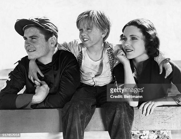 Mickey Rooney, Tom Brown, and Maureen O'Sullivan in scene from MGM's picture Fast Companions in 1932.