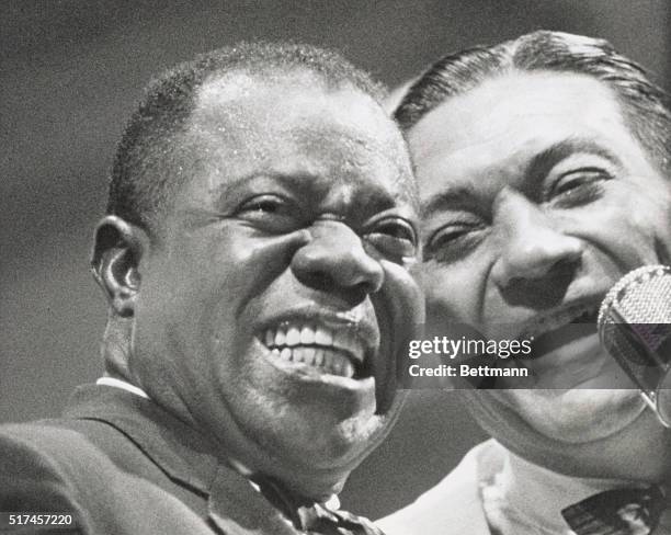 Deft jazz musicians Louis Armstrong and Jack Teagarden star in Bert Stern's documentary Jazz on a Summer's Day.