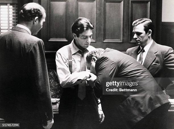 Clemenza kisses the hand of the new "Godfather", Michael Corleone , in the last scene of The Godfather.