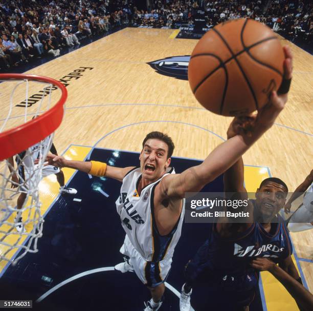 Pau Gasol and Samaki Walker of the Memphis Grizzlies attempts to rebound against the Washington Wizards during the game at the FedEx Forum on...