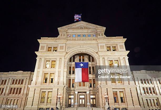 entrance to texas state capitol at night - texas state capitol stock-fotos und bilder
