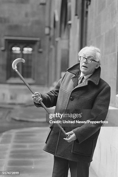 British Labour Party politician and Leader of the Opposition, Michael Foot pictured with a walking stick in London on 10th March 1982.