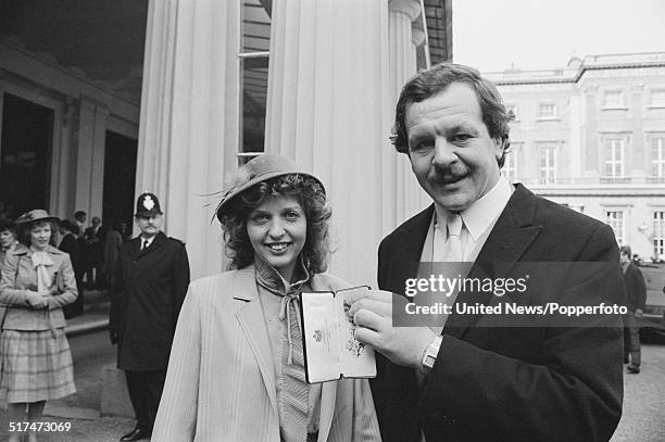 English rugby player and ex-captain of the England rugby union team, Bill Beaumont pictured with his OBE at an investiture ceremony at Buckingham...