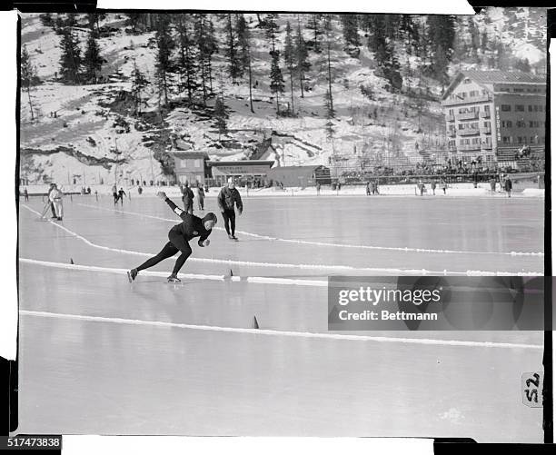 Soviet speed skater Evgenyi Grishin flashes around the rink on Lake Misurina to win the Olympic 500 meter speed race and set a new world record for...