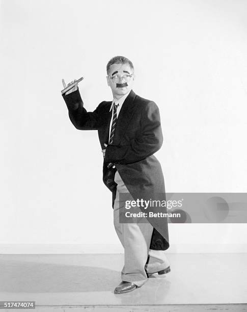 Mickey Rooney during the making of Drive A Crooked Road for Columbia 1953, doing a Groucho imitation.