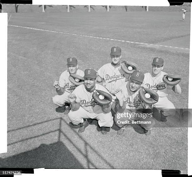 On hand for opening day of spring training February 22, at Vero Beach, are these world champion Brooklyn Dodger catchers. In front are Roy Campanella...