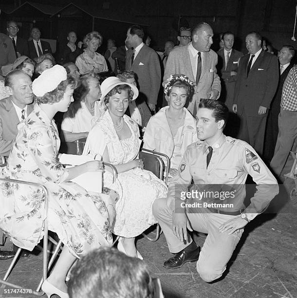 Elvis Presley takes a break from shooting G.I. Blues at Paramount Pictures Studios to meet with princesses Margrethe of Denmark, Astrid of Norway,...