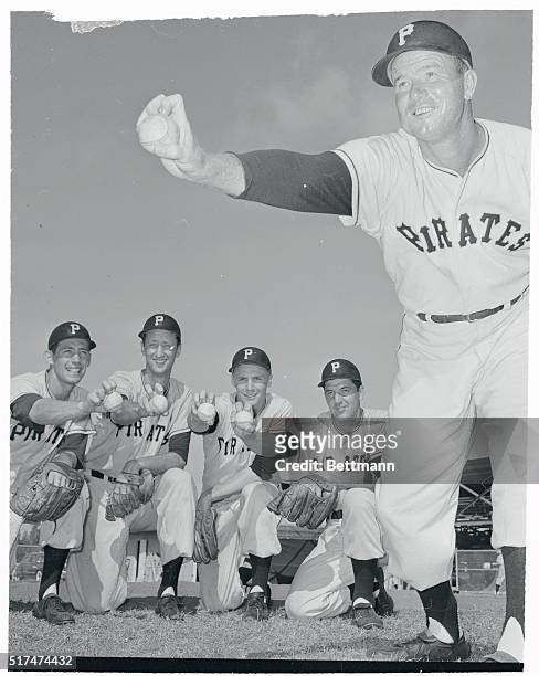 George "Red" Munger, an old pro who used to star with the Cardinals and is now trying to comeback with the Pittsburgh Pirates, has an eager quartet...