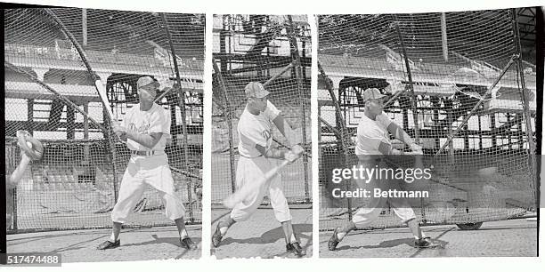 The champion Brooklyn Dodgers' new slick-fielding second baseman Charley Neal takes his cut at Ebbets Field April 16th in a preseason workout. Neal,...