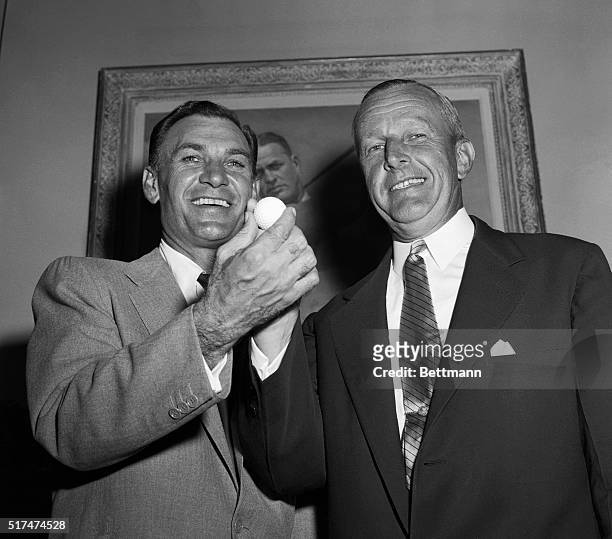 Bantam Ben Hogan, hailed in New York today as "Mr. Golf" on his return from victory in the British Open in Scotland, is shown as he presented the...