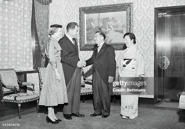 The Emperor of Japan, Hirohito and Nagako, the Empress of Japan greet Vice President and Mrs. Richard Nixon in the east chamber of the Imperial...