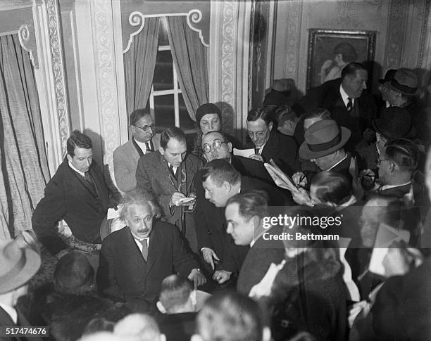 Scientific interview...A horde of reporters surrounding Professor Albert Einstein, great European scientist and author of the theory of relativity,...