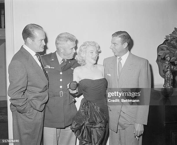 Photo shows, left to right: Joe DiMaggio; Marilyn Monroe; General William Dean, and Bob Hope at Hope's home where Bob and Mrs. Hope gave a party for...
