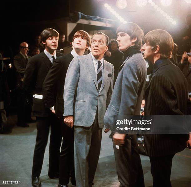 The Beatles with Ed Sullivan during the taping of their New York Debut show.