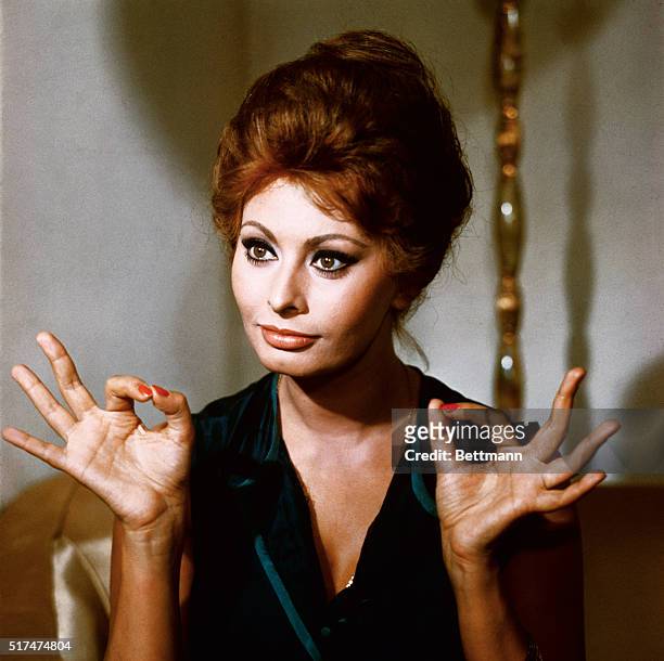 Actress Sophia Loren in a publicity photo with both hands showing the A.O.K. Sign.
