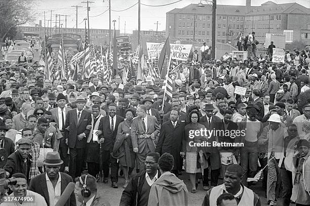 Dr. Martin Luther King leads an estimated 10,00 or more civil rights marchers out on the last leg of their Selma-to Montgomery march. Others...