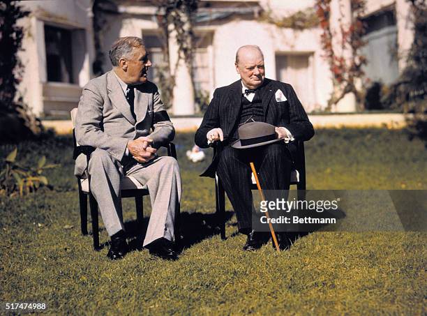 President Franklin D. Roosevelt and Prime Minister Winston Churchill talk on the lawn of the President's villa during the Casablanca conference.