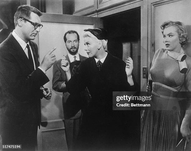 Barnaby and Edwina Fulton bicker in Monkey Business. Barnaby's secretary Lois Laurel stands to the right.