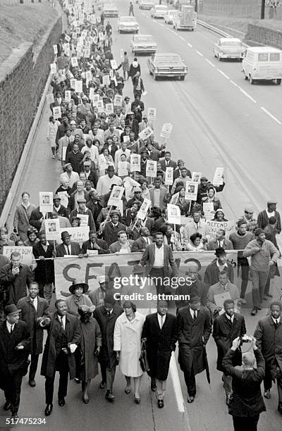 Atlanta, Georgia: Dr. Martin Luther King, with his wife , lead a march of about 800 to the Georgia capitol to protest the ousting of State...