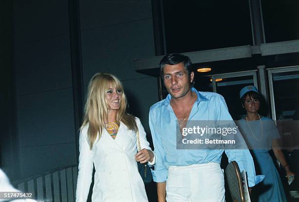 French actress Brigitte Bardot and her new husband, German industrialist Gunther Sachs, leave Los Angeles International Airport on a flight bound for...