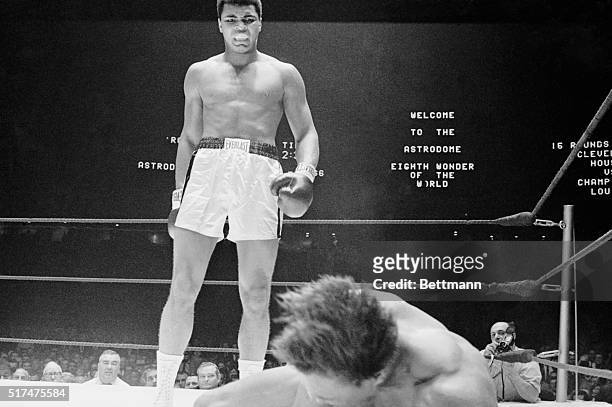 Challenger Cleveland Williams hits the canvas in the 3rd round of fight with heavyweight champion Cassius Clay. Clay scored 3rd round TKO to retain...