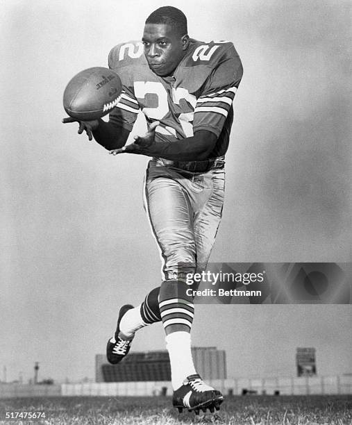 Portrait of Dallas Cowboys player Bob Hayes, making a catch. Undated photograph, circa 1960's.