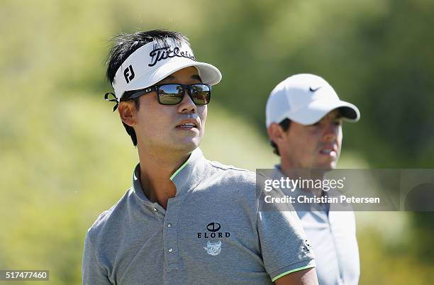Kevin Na of the United States and Rory McIlroy of Northern Ireland wait on the third tee during the third round of the World Golf Championships-Dell...