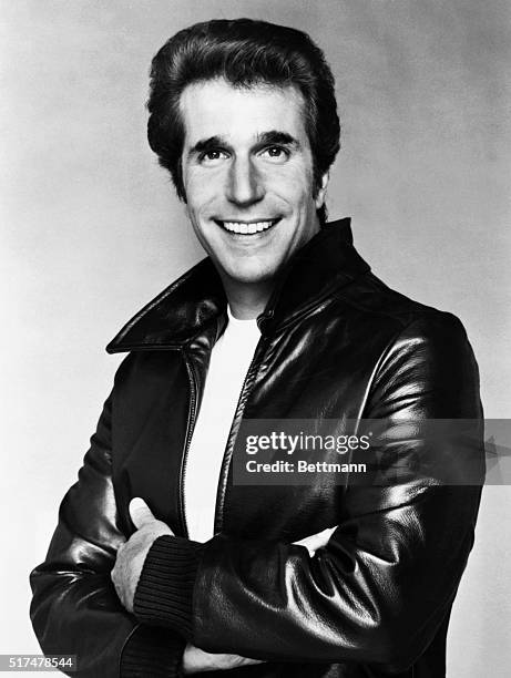 Henry Winkler in a leather jacket posing.