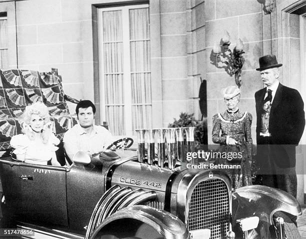 Television still from The Beverly Hillbillies. In this scene, Donna Douglas as Elly May and Max Baer, Jr., as Jethro Bodine are seated in an...