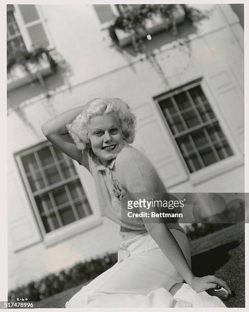 Jean Harlow, MGM star, is a great lover of the color white. She lives in a white house, favors white clothes, is famous for her platinum colored...