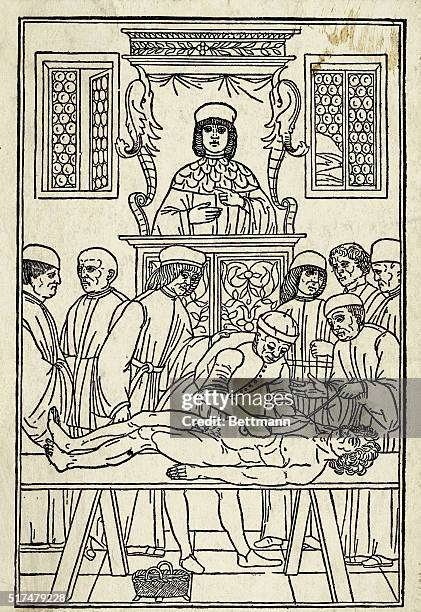 Anatomy lesson of the 15th Century. The lecturer reads from Galen while the teacher points to respective parts of the body. Illustration from...