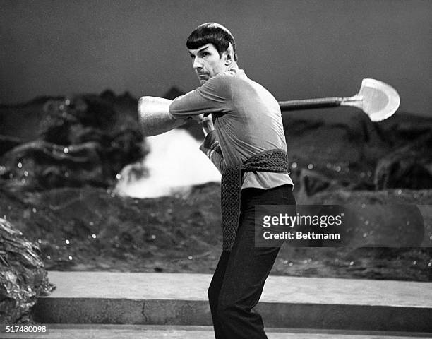 Leonard Nimoy played a Vulcan, Commander Spock, a crew member of the Starship Enterprise in the Star Trek American TV series.