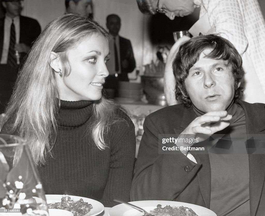 Roman Polanski and Sharon Tate Sitting at Table for Meal