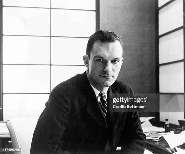 Founder of Playboy magazine and empire, including the Playboy Clubs, Hugh Hefner, in his office.