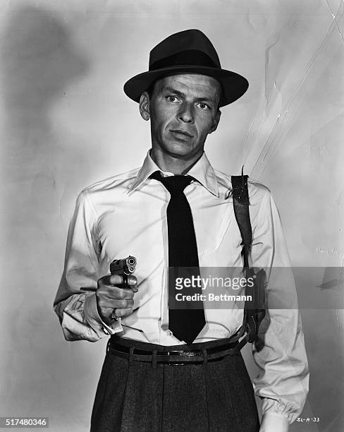 Publicity Photo of Frank Sinatra holding a gun as John Baron in the 1954 film Suddenly.
