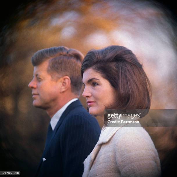 President and Mrs. Kennedy are shown on the White House lawn as they witnessed part of the performance of the Black Watch Royal Highland Regiment....